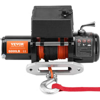 Treuil électrique 6000 lb vu de face avec guide-câble, corde orange et sangle rouge